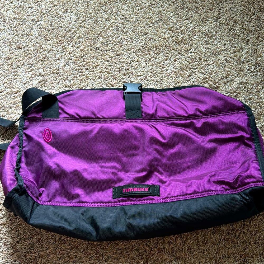 A duffel style gym bag you can have a spot for your yoga mat.